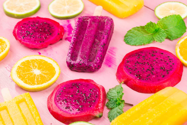 istock Various fresh fruit popsicles placed on wooden board background 1331740967