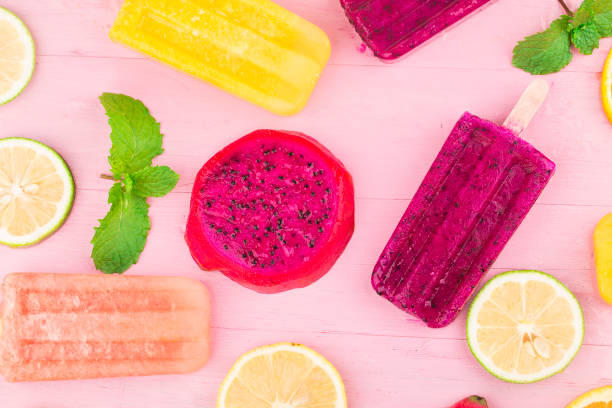 istock Various fresh fruit popsicles placed on wooden board background 1331741078