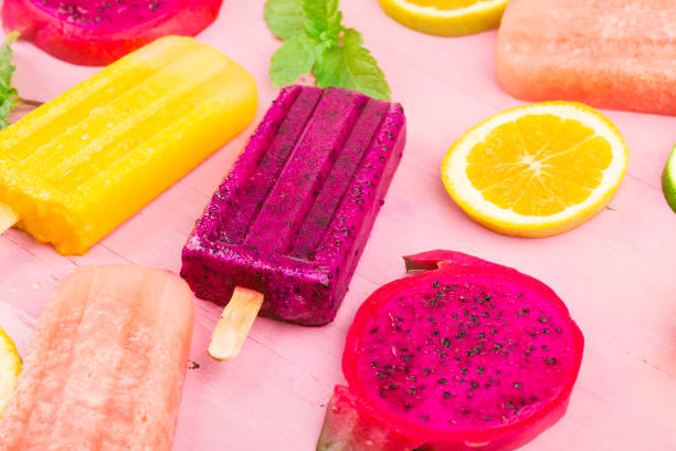 istock Various fresh fruit popsicles placed on wooden board background 1331741119
