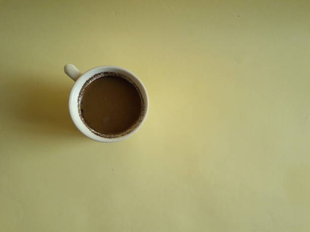 istock black coffee photo on yellow background 1331751197