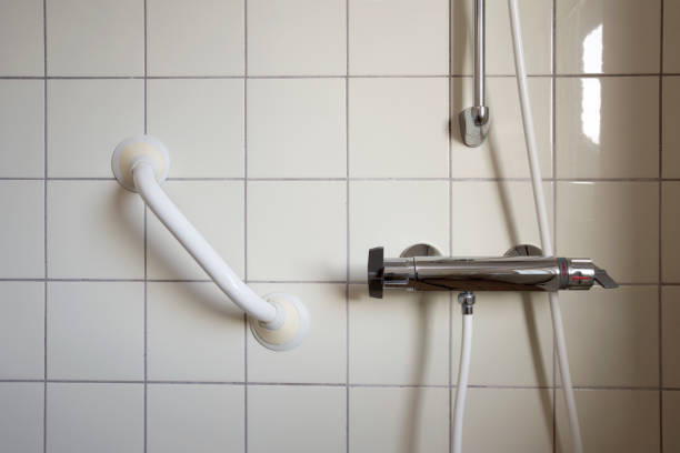 Shower and handrail,grab bar for elderly people at the bathroom in hospital or retirement home , safty and medical concept stock photo