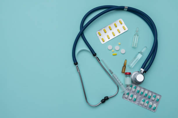 istock A stethoscope, ampoules, a syringe, a mask and tablets. Medical concept. 1331753674