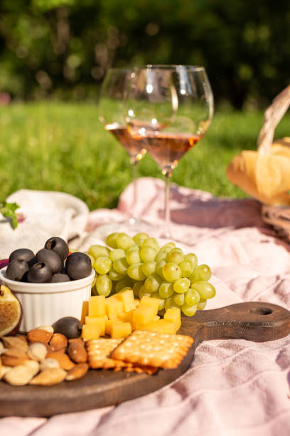 istock Romantic picnic with wine in a summer garden 1331756663