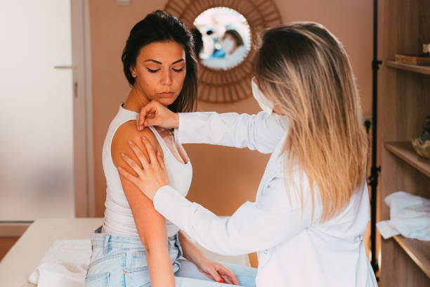 istock Young woman having acupuncture treatment on her arm 1331764228