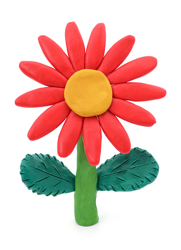 Plasticine red flower with leaves isolated on a white background.