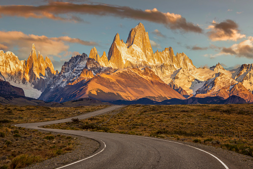 A windy road leads to Mt. Fitz Roy, surrounding mountains and the town of El Chalten, Argentina