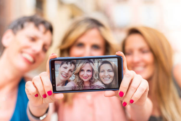 istock Three mature female friends taking a selfie horizontally 1331770035