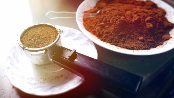 istock Coffee grounds,Coffee maker rod, coffee maker on plate and coffee grounds. 1331773867