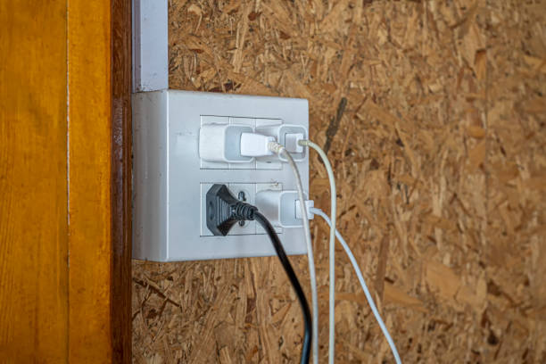 istock The old electrical plug next to the cream wall. 1331773908