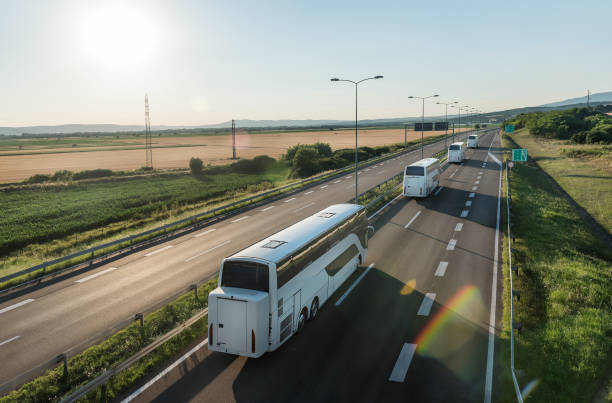 istock Series of Modern White buses departing 1331775613