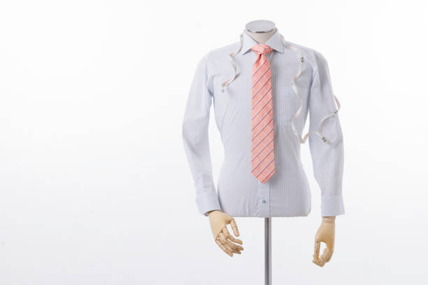 business and office concept - handsome buisnessman with jacket over shoulder pointing finger at you