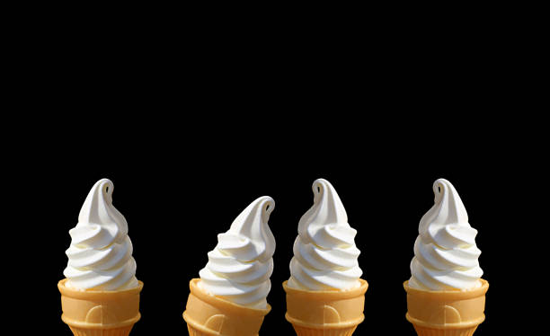 istock Rows of Delectable Vanilla Soft Serve Ice Cream Cones on Black Background with Copy Space 1331777793