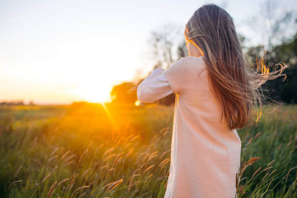 istock Little girl playing on field 1331778947