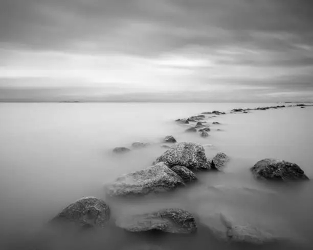 Long exposure shot of stony formation at the Gulf of Finland