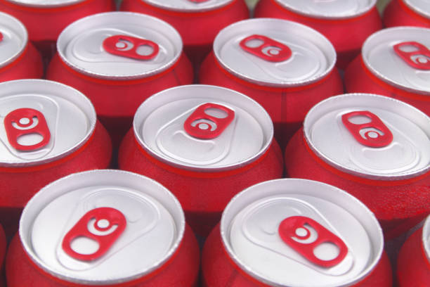 istock Red tin cans close up. Beer or soft drink cans background. 1331783571