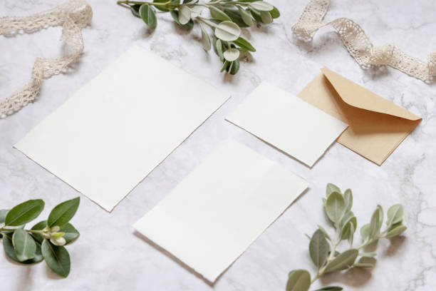 istock Wedding blank cards laying on a marble table decorated with eucalyptus branches 1331783892
