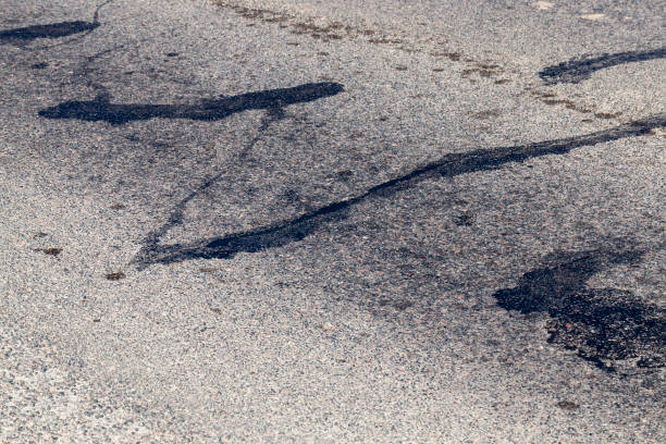 istock part of an asphalt road with damage 1331784105