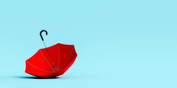 istock Red umbrella on blue background. Autumn concept. 1331785125