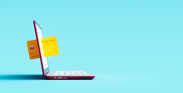 Online shopping concept. Credit card and laptop computer on blue background 3D Rendering, 3D Illustration