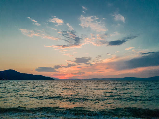 istock Amazing colourful dramatic sky with clouds, blue and red orange before sunset in Greece 1331787124