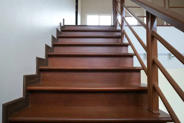 beauty wooden stair in new house . oak color iron Handrail decor interior estate. abstract going up to goal.