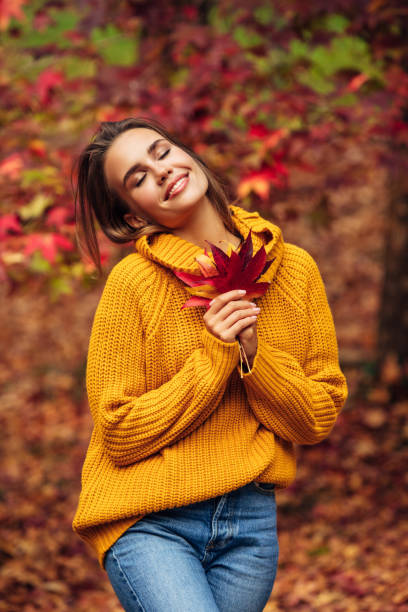 istock Beautiful woman holding a leaf 1331788912