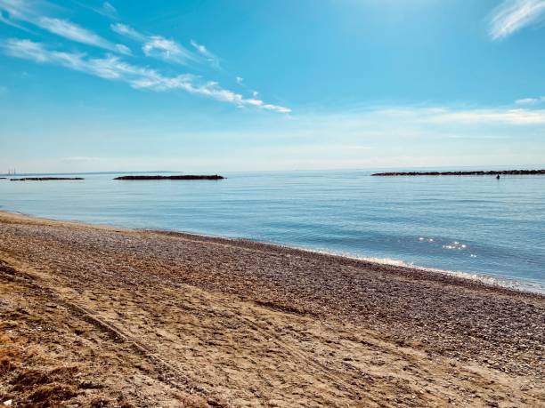 istock Calm water from the sandy beach view background 1331789025
