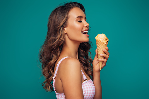Beautiful girl holding ice cream