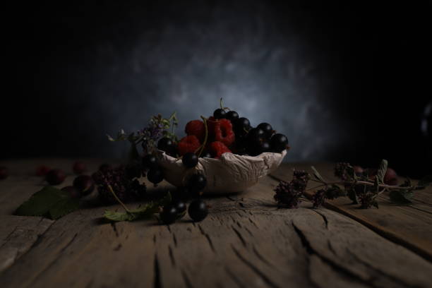 juicy berries on a vintage wooden table with a pronounced texture