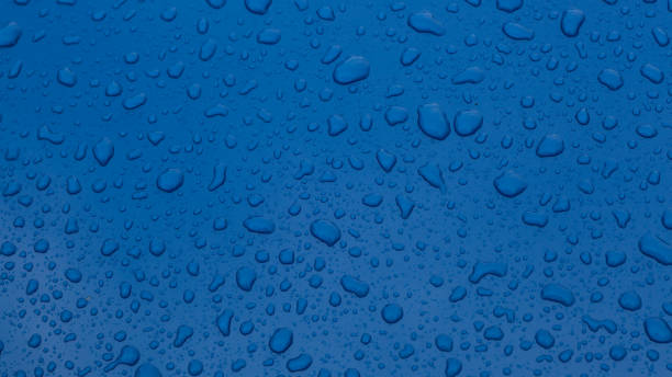 Raindrops on blue background stock photo