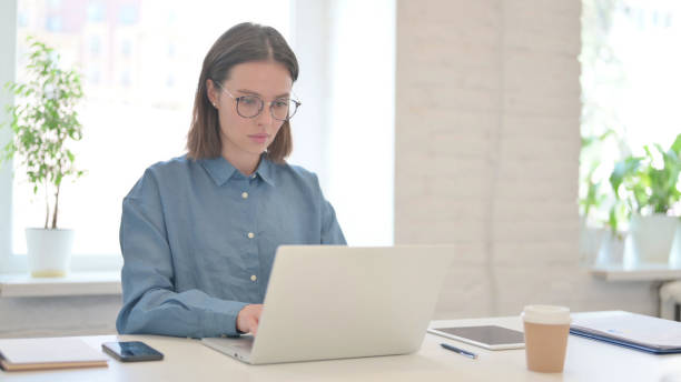 istock Young Woman Working on Laptop in Office 1331795178
