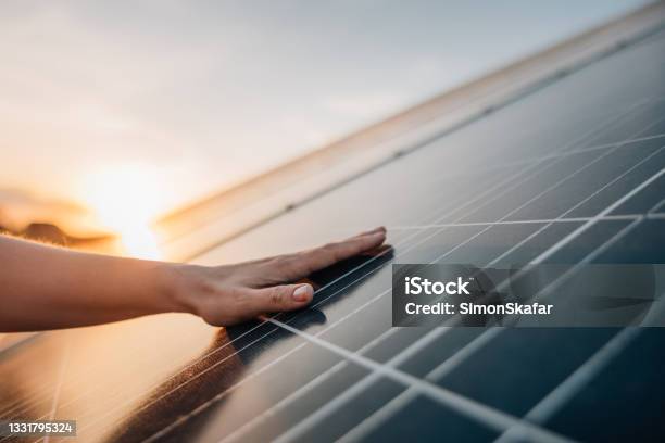 Human Hand Touching Solar Panel Stock Photo - Download Image Now - Solar Panel, Solar Energy, Solar Power Station