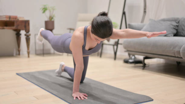 istock Young Indian Woman doing Excersie During home Workout 1331796395