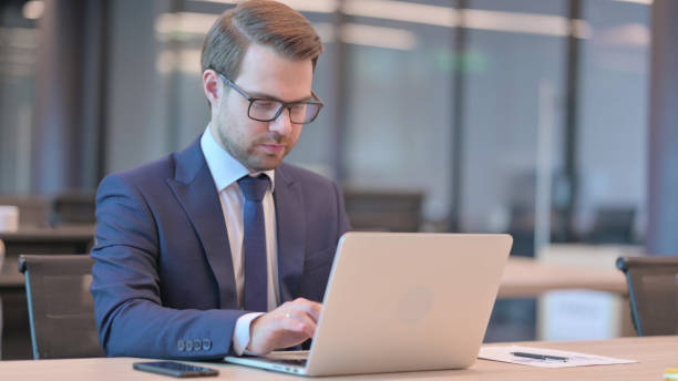 istock Businessman Working on Laptop in Office 1331796483