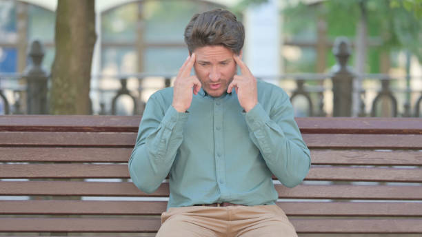 istock Upset Middle Aged Man Worried While Sitting,, Outdoor 1331796823