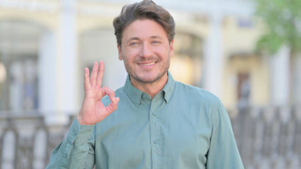 istock Positive Middle Aged Man showing OK Sign 1331796874