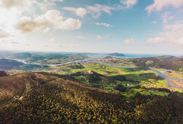 360 degree panoramic taken with drone of the bay of the Asón estuary that connects Colindres, Laredo and Santoña through the sea made from the Candiano peak, in Cantabria. Top aerial view. 360 degree panoramic taken with drone of the bay of the Asón estuary that connects Colindres, Laredo and Santoña through the sea made from the Candiano peak, in Cantabria. Top aerial view. cantabria stock pictures, royalty-free photos & images