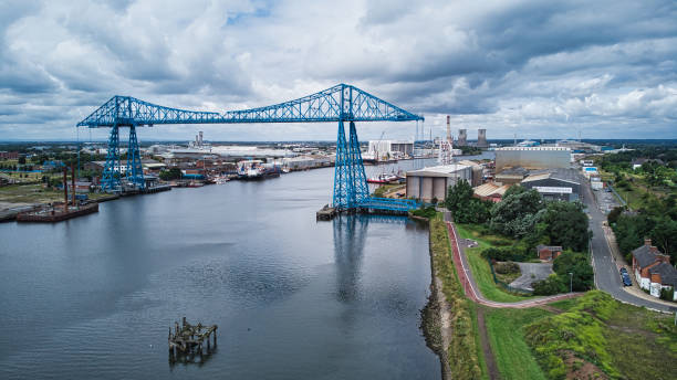 Middlesborough transporter bridge crossing River Tees, Middlesborough, North Yorkshire, England, Britain Blue painted Tees transporter bridge cleveland england stock pictures, royalty-free photos & images