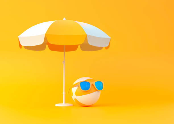 beach ball under umbrella wearing sunglasses on yellow background - beach ball summer ball isolated imagens e fotografias de stock