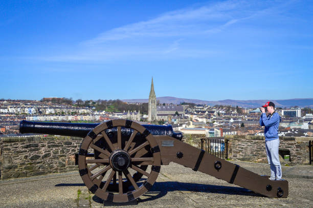 Londonderry, UK, March, 2017. The restored cannon placed on the Derry City Wall in a sunny day.