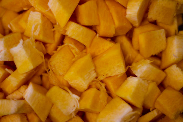 istock Beautiful fall background. Ripe pumpkin, chopped and diced 1331803970