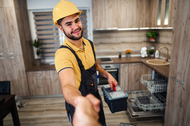 istock Young male plumber shaking hands in kitchen 1331805364