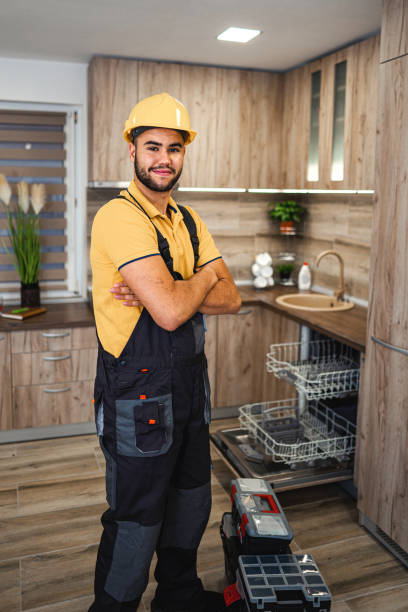 istock Young male plumber in kitchen 1331805389