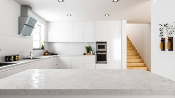 Empty Stone Kitchen Countertop In Modern Kitchen Empty white stone kitchen countertop with copyspace. Focus on foreground. domestic kitchen stock pictures, royalty-free photos & images