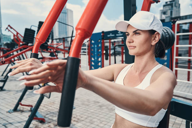 istock Athlete getting ready for workout on street exercise equipment 1331806875