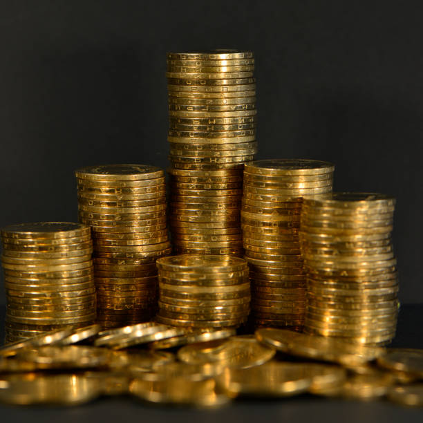istock Stacks of Golden Coins on a Dark Background. 1331809333