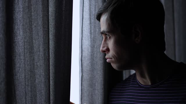 Man looking out of the window