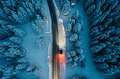 High angle view of car on road in snow covered forest
