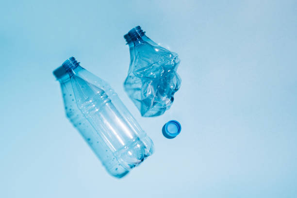 istock Used empty crumpled plastic bottles on blue background. Recycling recycled plastic. Pollution, environmental protection. 1331811812