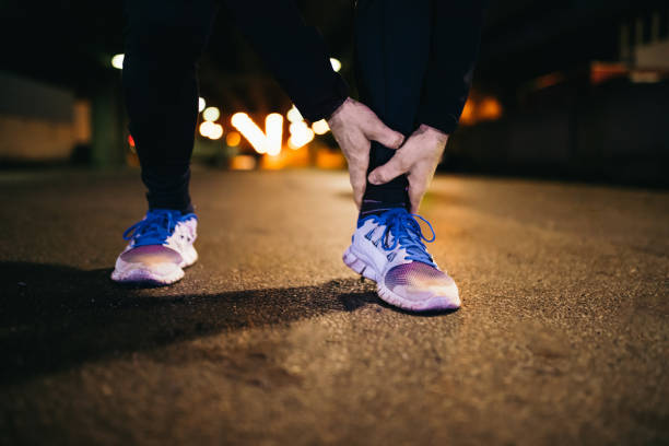 istock Man holding his ankle in pain 1331813601